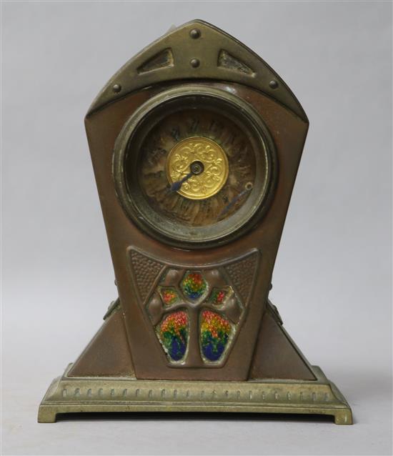 An Arts and Crafts brass and copper timepiece